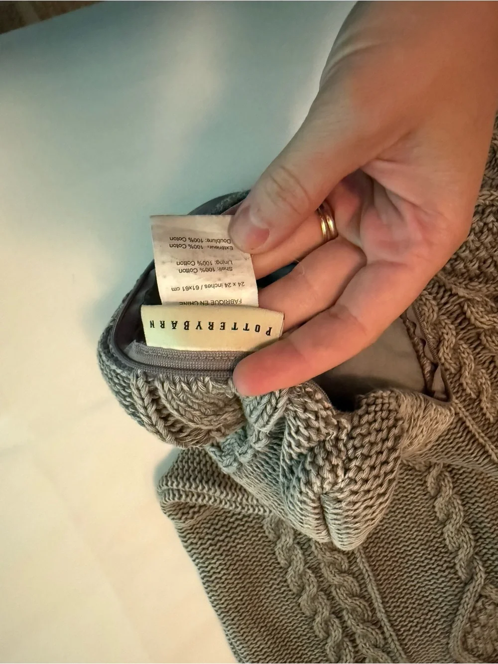 Pottery Barn gray knit throw with charcoal pillow cover